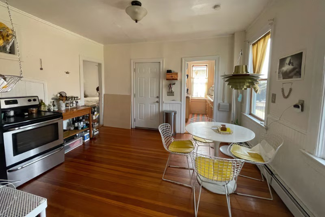 Kitchen / Dining Room, to the left is a bedroom, center door leads to the side entrance. - Spacious 2nd floor Apartment in the Heart of Providence.