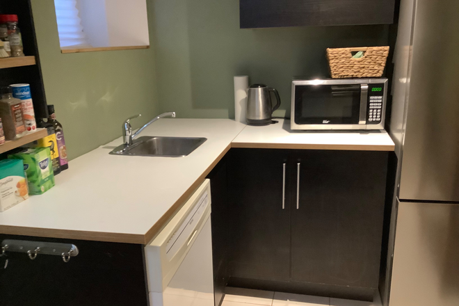 Kitchen as you enter - Furnished Basement Apartment with Private Entrance and Laundry