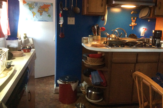partial view of kitchen - lots of cabinet space, has a table as well - Private home shared space