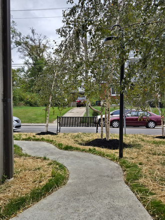 Walkway to parking lot - The Inn on Forest; Free first months rent and half off security deposit. Apply now Apartments