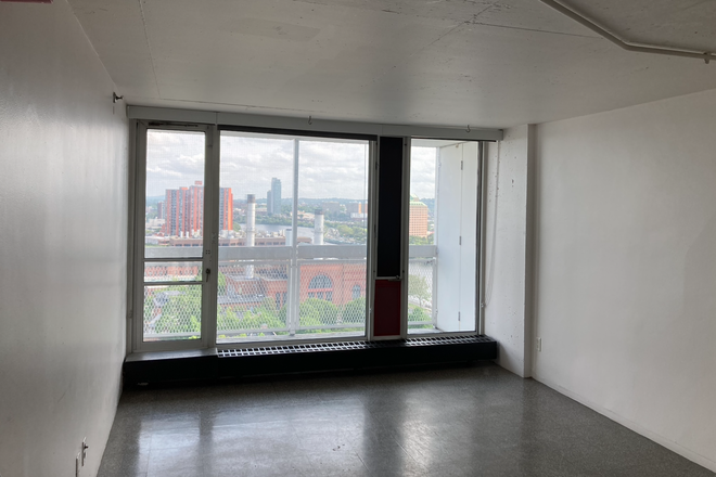 Dinning room and balcony - Peabody Terrace, 19th Floor, River Sight Apartments