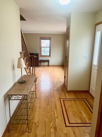 Open foyer with Hardwood Floors (View Toward Living Area) - 4BR/2.5BA Two-Story Home | West Side Iowa City | 2-Car Garage