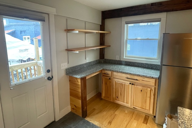 Entry to apartment comes into 1st counter area with open shelving and cabinets - 2 Bedroom, 1st floor apartment at 149a Pine St.