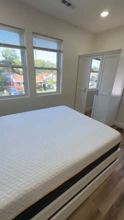 Furnished Sleeping Area with Natural Light - Private Furnished Studio Near UMD | Private Entrance & Bath | Utilities Included Apartments