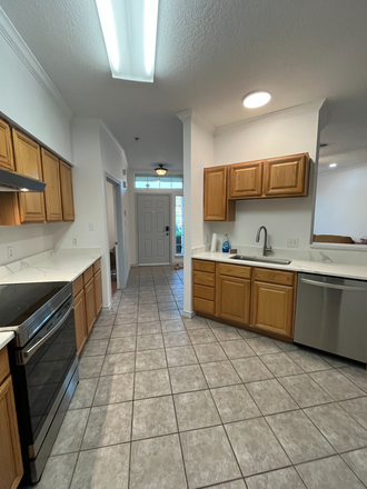 Kitchen w/view of front door - Renovated condo on bus line - 2 rooms available - all utilities inc.