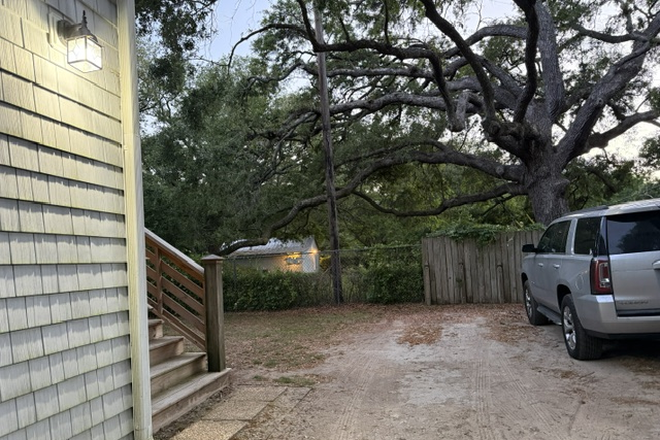 Parking area for two cars - Two-bedroom garage apartment overlooking Clark Sound on James Island. Rent includes all utilities.
