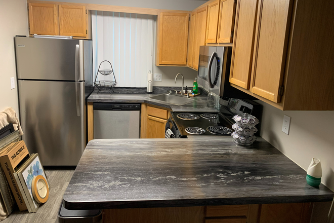 Kitchen, 4 person table to the left - Sugarloaf Estates Apartments