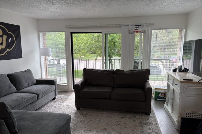 Living area and balcony - College Townhomes