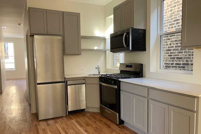 Kitchen view from living room - NEW FULL OF LIGHT 4BDRM 2BTH PILSEN Apartments