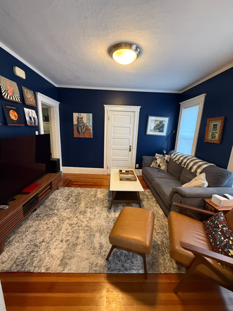 living room - 2BR Condo Near Harvard (12 mins) – Private Laundry, Deck & Water Included