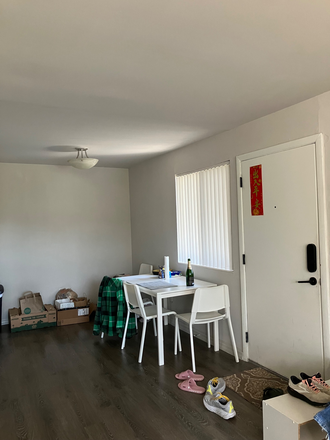 Front door and other half of living room/dining area - The Wynwood 1b/1b, 5 min drive to campus, in-unit laundry Apartments