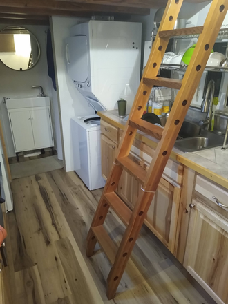 Folding ladder to loft l, kitchen sink, laundry, and bath - Tiny House
