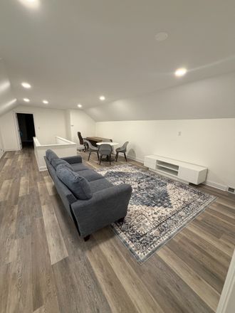 loft living room and dining space - Executive Furnished 4BR Home on 2 Private Acres | 10+ Parking | Near Duke & RTP