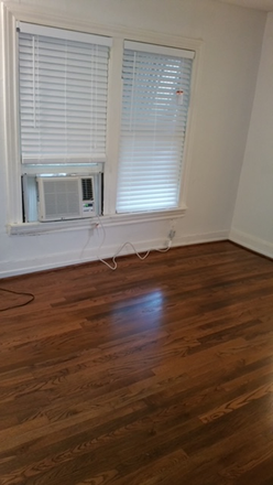 LIVING ROOM WITH HARDWOODS - Garage Apartment, five rooms in back of charming bungalow. Washer/dryer street parking