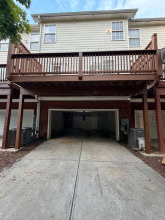 Rear 2 car garage with parking for 2 cars under deck - Chastain Park at KSU Townhome
