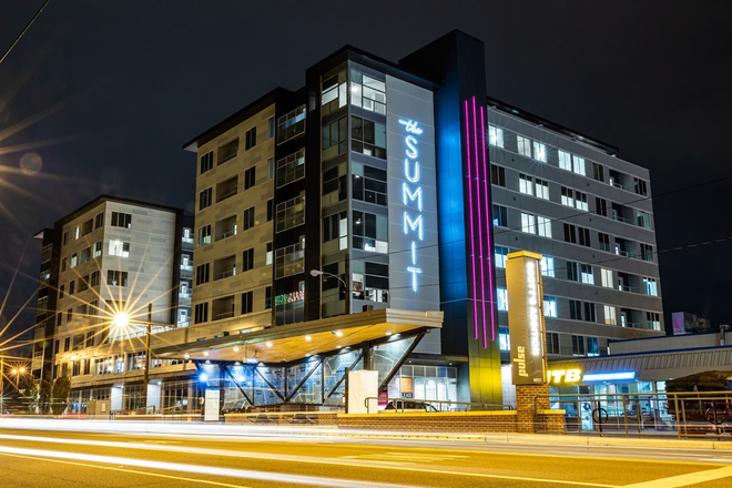 Night view of the exterior of the building - Fully Furnished Luxury Modern Apartment in Scott's Addition with access to pool and gym