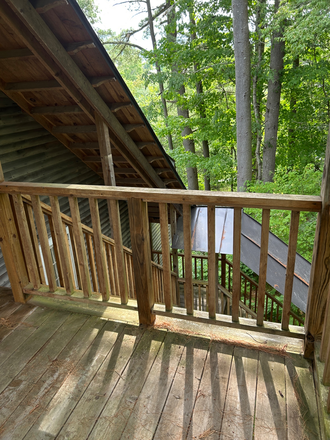 Private covered Deck - Tree Top Studio Apartment