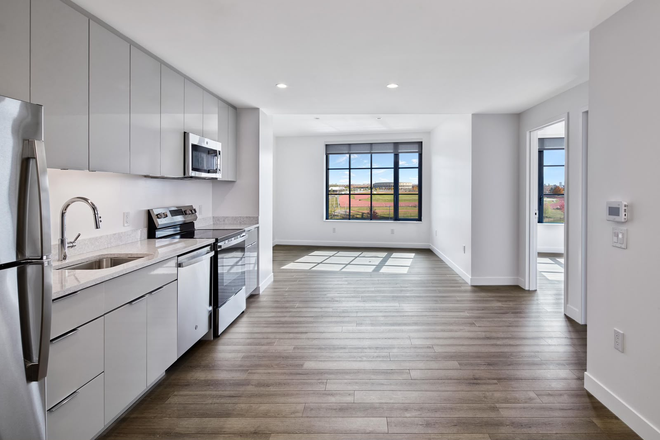 Kitchen and Common room (AI generated image, taken from website but it is same as unit) - 100 South Campus Drive Apartments