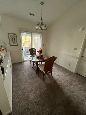 Dining room next to kitchen (shared space with 1 roommate). Will stay furnished. External view of balcony. - Treybrooke Apartments