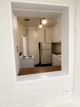 kitchen passthrough - Spacious One Bedroom Apartment One Block from Peabody/JHMI Shuttle stop