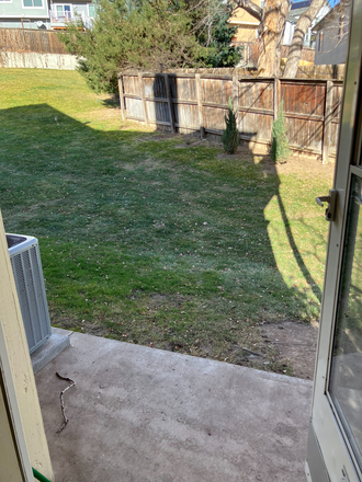 patio with side yard - Hunter Ridge Townhome near downtown Louisville