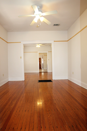 View of living and dining rooms from front door. Hardwood floors! - 2-Bedroom Apartment – 2431 Palmer Ave.- VERY close to Tulane & Loyola Universities