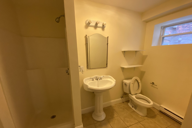 Visit hubrealtyproperties.com - Renovated one bedroom, basement level, on the T in Mission Hill, near HMS Apartments