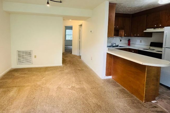 Kitchen and living room - Townhome next to Lane Stadium, walking distance from campus and downtown
