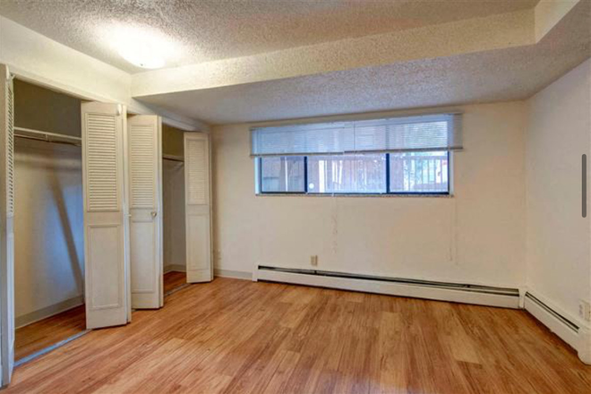 Subleased bedroom photo II, showing wall and window - Four Star Realty Apartments