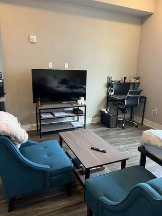 Large TV and living space (included) - Yugo Apex College Station Apartments