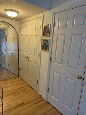 hallway to bathroom. First closet is the pantry, the double doors is another closet. - Unfurnished Studio Apartment Close to the Corner