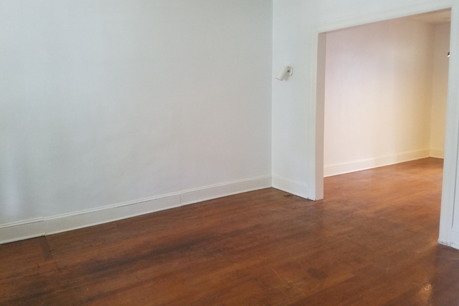 Living Room and Dining Room - Large 6 Bedroom Townhome Close to Campus