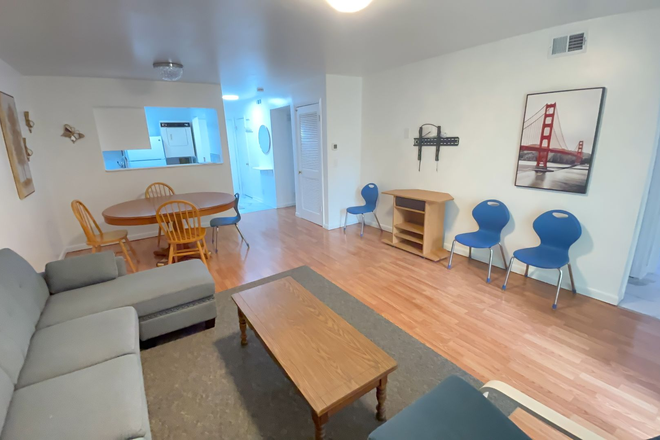 Living area - Four bedroom two bath condo for rent in Hunters Ridge - Electric and Water Included - Furnished!