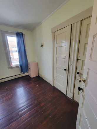 Corner of 2nd Bedroom, refrigirator included - Bright & Cozy Room in 3-Bedroom Rowe House, Parking & Grocery Access