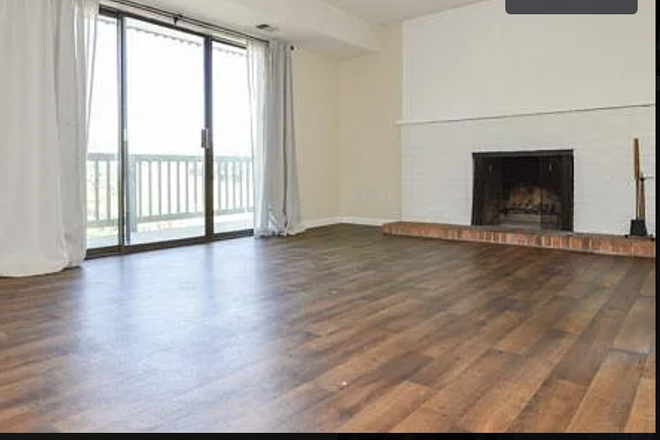 Main Living Room with Fire Place. Note: this is a picture from an apartment in the same complex so photo is not exact. - Baseline Towers - Across Broadway From Campus