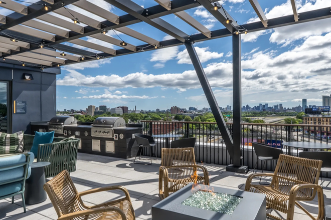 Sky Lounge, Grilling Station, and Fire Pit with a View At The Indie - The Indie - New Allston Apartments