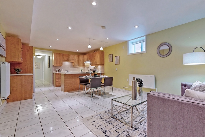 open concept kitchen and living room - Little Italy 2-Bedroom High Ceiling Basement Apartment