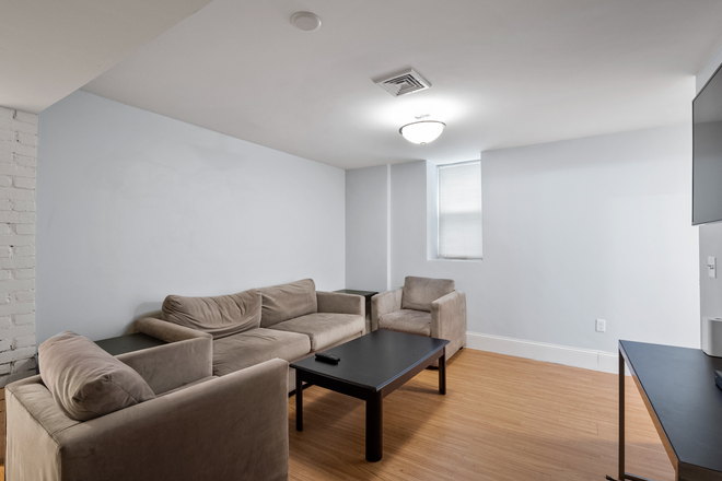 living room unit 1 - Fully furnished 5 bed/2bath available immediately Apartments