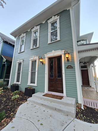 Newly renovated exterior. Porch railing has just been added but cannot be seen in this photo. - Fully Furnished 2 Bed/1 Bath with Utilities Included Duplex