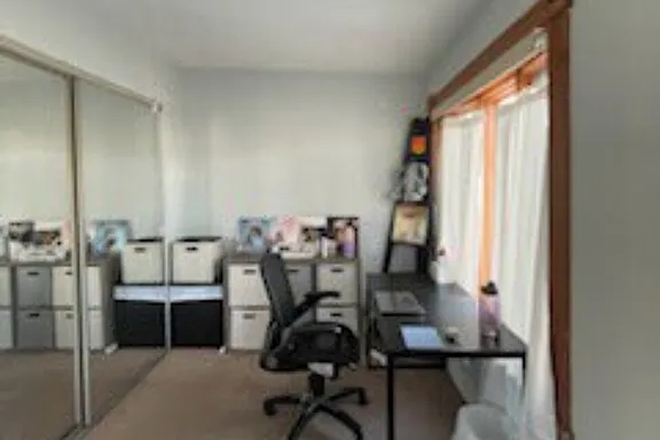 Bedroom desk area with double window and cupboard having mirrors - Charming Fully Furnished Spacious Room with Sunroom Townhome