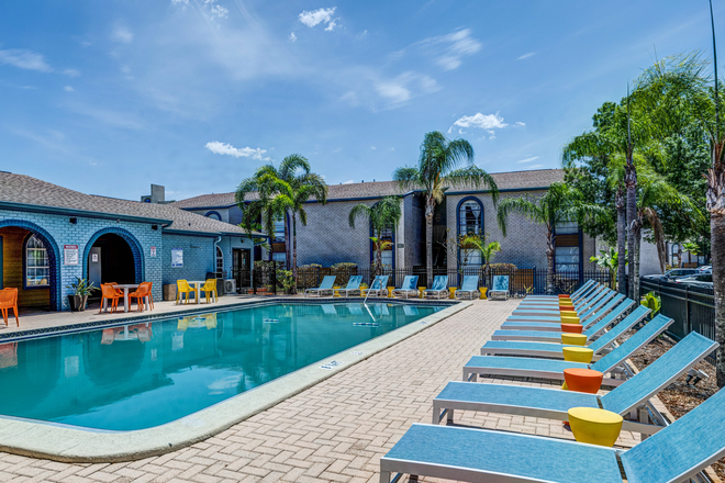 New cabana seating at pool - College Town at USF Apartments