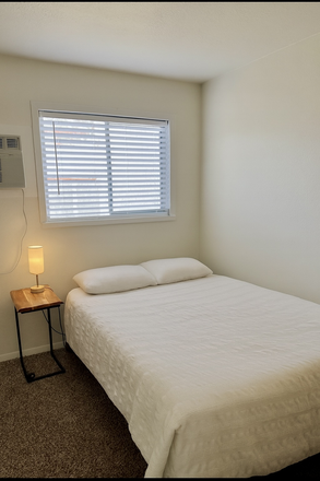 Bedroom with closet, bed, night table, and desk included. - House on the Hill