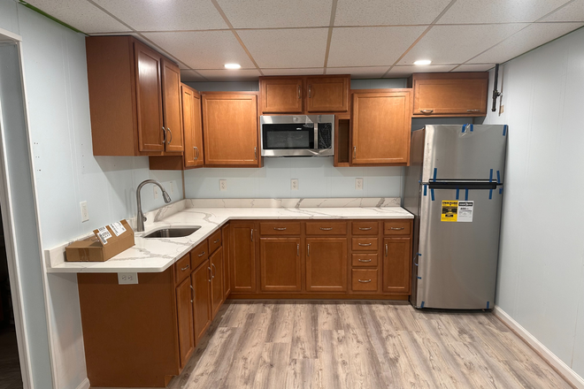 Kitchen. There is a four burner stove below the microwave (not pictured here). - Lastner Lane House