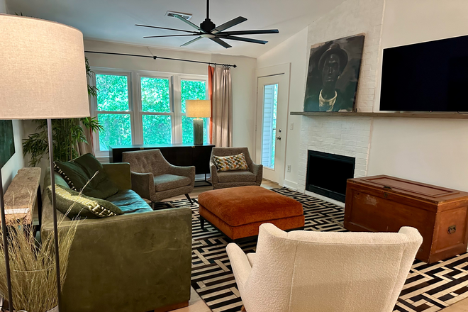 living area with beautiful and serene wooded view - The Meridian Condos