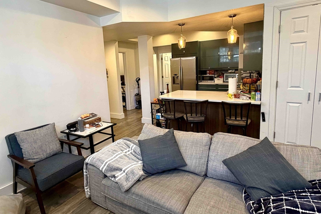 living - SPACIOUS BRIGHT 4 BED/2 BATH WITH IN-UNIT LAUNDRY AND WATER/SEWER INCLUDED! 9/1/26! Apartments