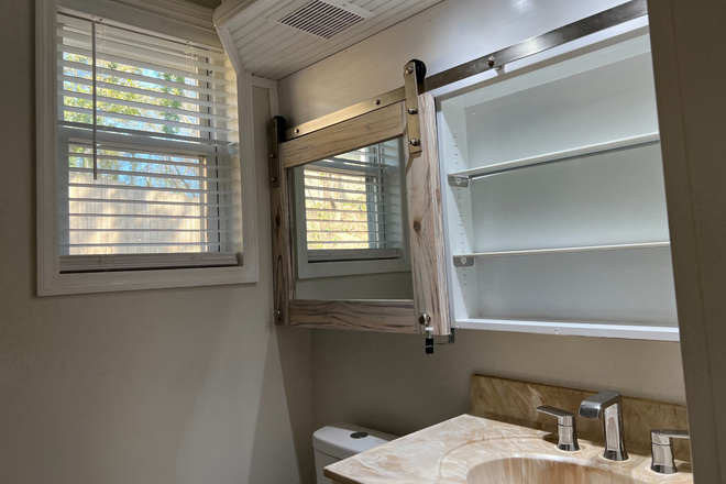 Bath with open barn door vanity mirror/cabinet - 614 Agnes Rd. 4-Plex Triplex