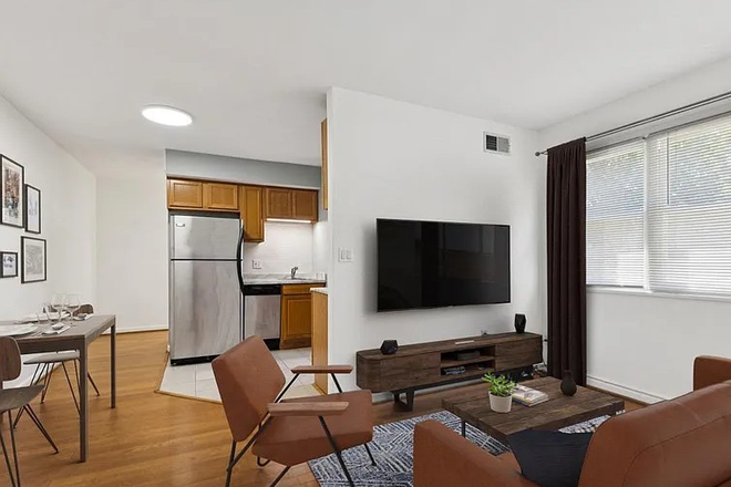 living room - All-Inclusive 2BR Living + 100% Utilities + Parking + In-unit Washer/Dryer – Steps to CU Condo