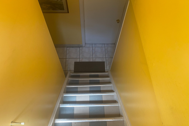 Separate entrance looking down into unit - 2 Bedroom, furnished, basement apartment for rent in Highland Creek (Avail from September 1, 2026)