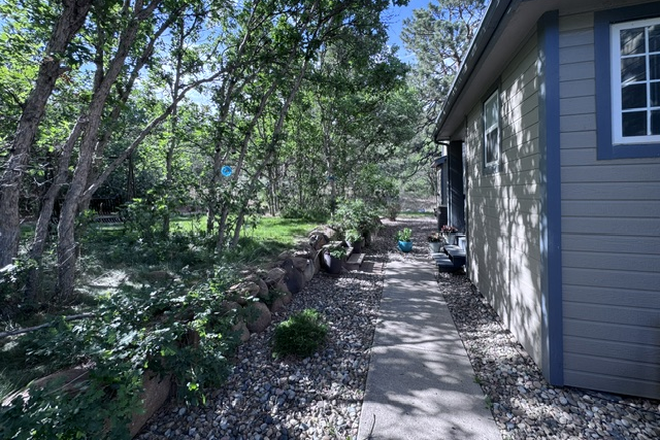 side of house - Peaceful Furnished Room with 3-Piece Bath Near UCCS – Quiet Academic Home, Tree Views & Trails