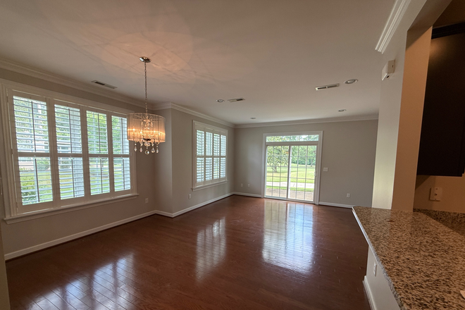 dinning into living - Golf Course Tranquility — Effortless One-Level Living with attached Garage in Williamsburg Condo